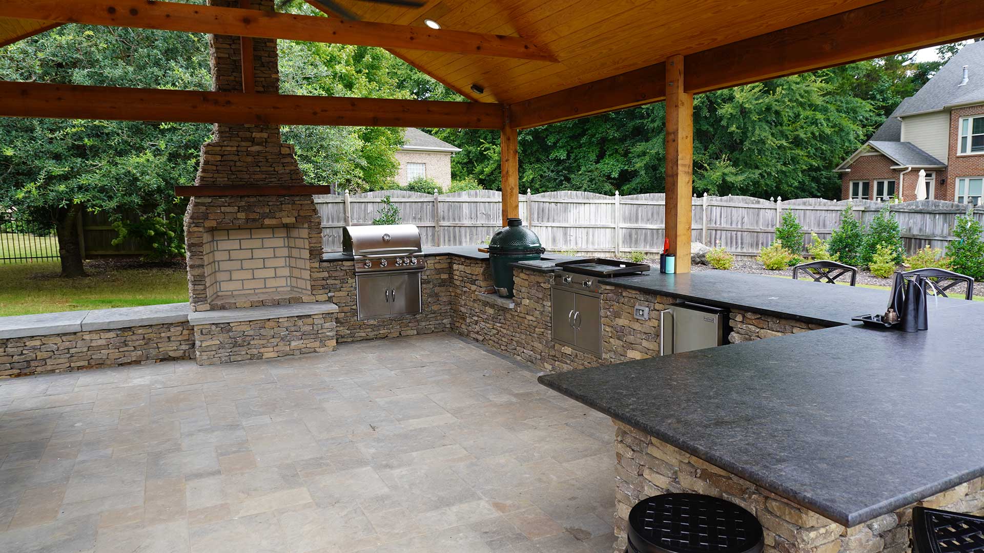 Outdoor kitchen with natural stone and custom pavilion near Huntsville, AL.