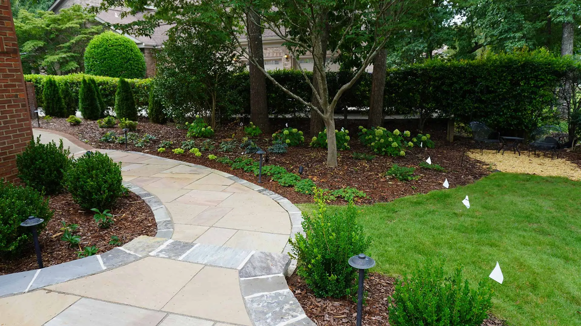 Walkway installed with landscape bed maintained in Fayetteville, TN.