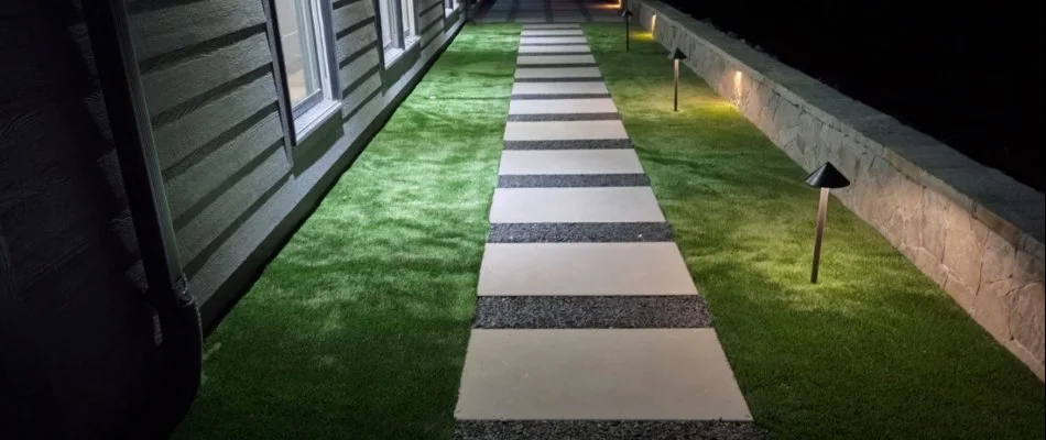Artificial turf in Huntsville, AL, and paver walkway.