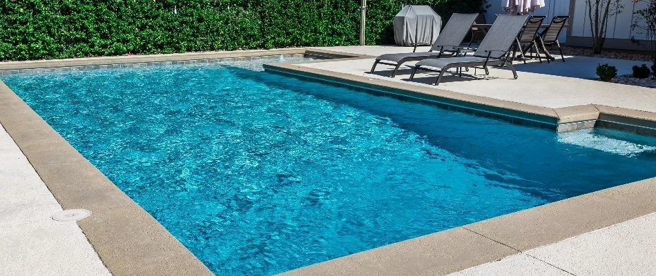 Chairs beside a pool in Huntsville, AL.