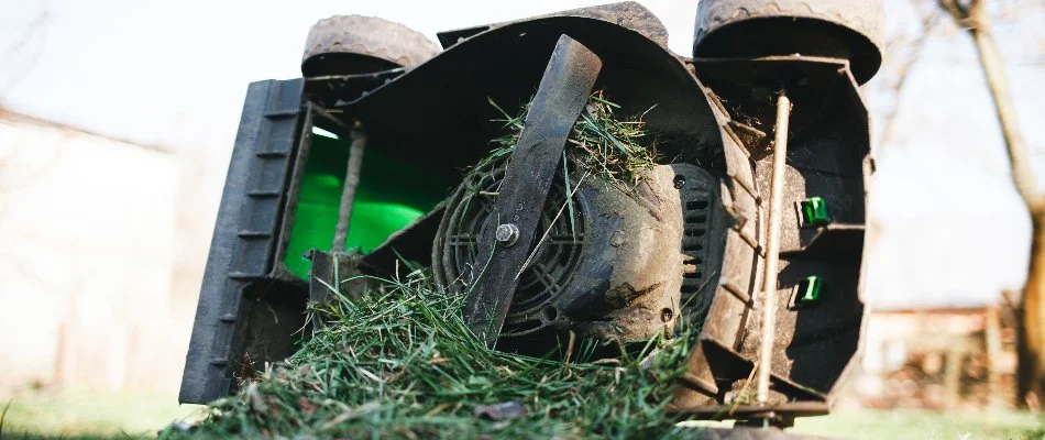 Clogged mower in Huntsville, AL, from wet grass blades.