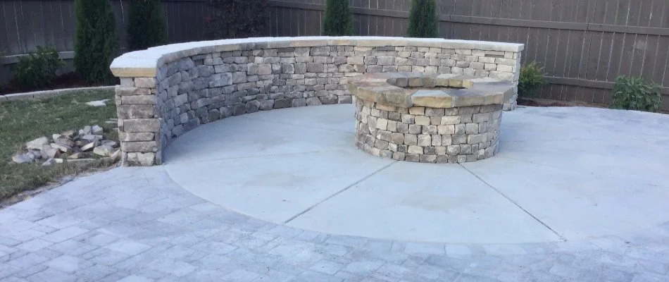 Fire pit and seating wall on a patio in Huntsville, AL.