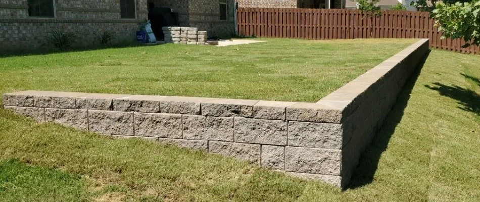 Green grass around a retaining wall in Huntsville, AL.