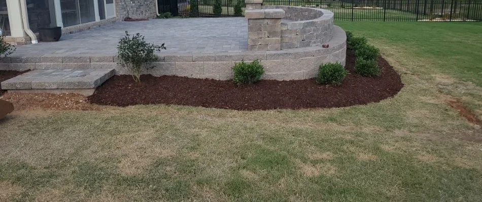 A landscape bed in Huntsville, AL, with fresh mulch.