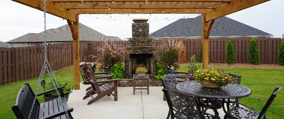Outdoor fireplace with chairs on a patio in Huntsville, AL.