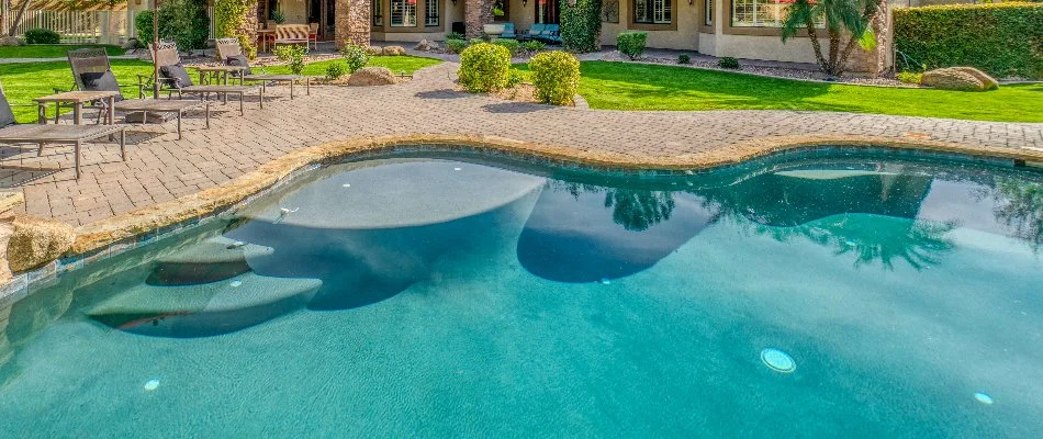 Paver patio around a pool in Huntsville, AL.