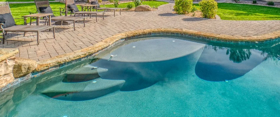 Pool in Huntsville, AL, with curved sun shelf.