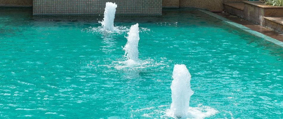 Pool in Huntsville, AL, with small fountains.