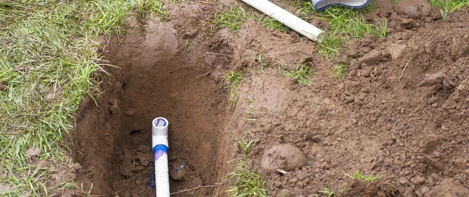 Trench in Huntsville, AL, with pipe for an irrigation system.