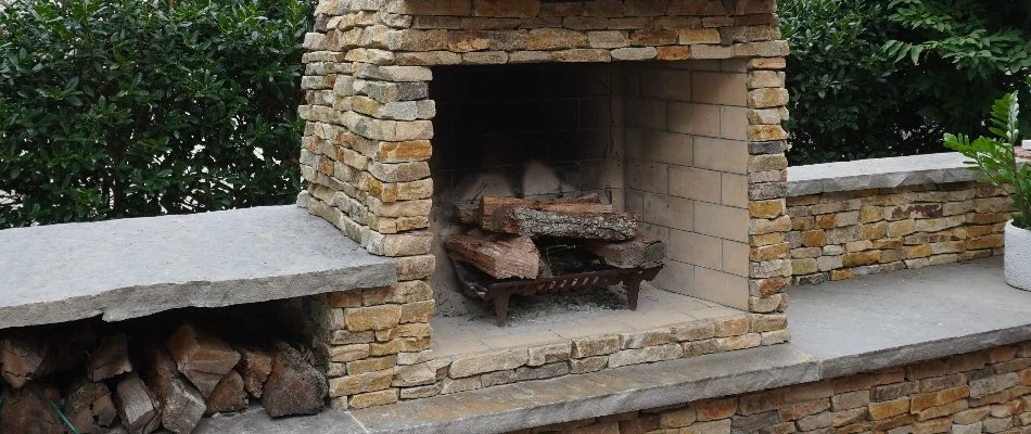 Wood-burning stone outdoor fireplace in Huntsville, AL.
