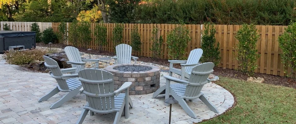 Fire Pit on Patio in Maysville, AL, with with chairs around it.