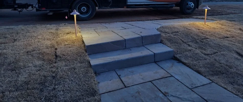 Landscape lighting in sod around outdoor steps in Huntsville, AL.