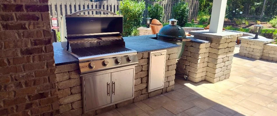 Outdoor kitchen with grill and a green egg on a property in Huntsville, AL.