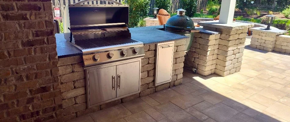 Outdoor kitchen with grills on a patio in Elora, TN.