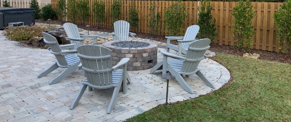 Patio in McMullen Cove, AL, with a fire pit and chairs.
