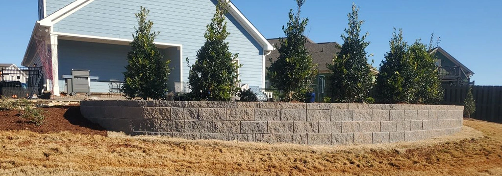 A retaining wall installed with landscape bed in Fayetteville, TN.