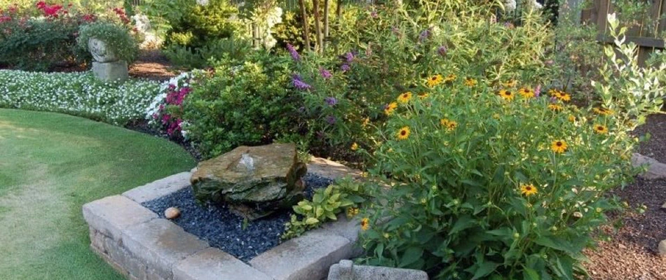 A rock bubbler installed in landscape in Huntsville, AL.