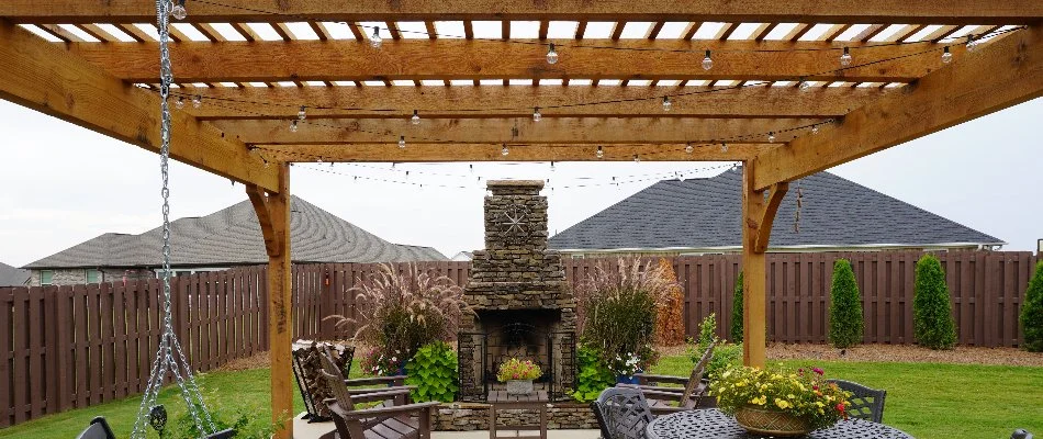 Wood pergola and an outdoor fireplace in Huntsville, AL.